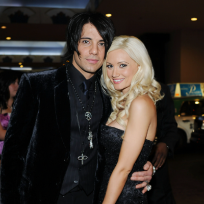 Criss rocking a full black outfit with his first wife JoAnn.